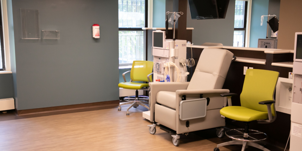 Photo of a hemodialysis chair in a clean and modern room with a TV and other comforts