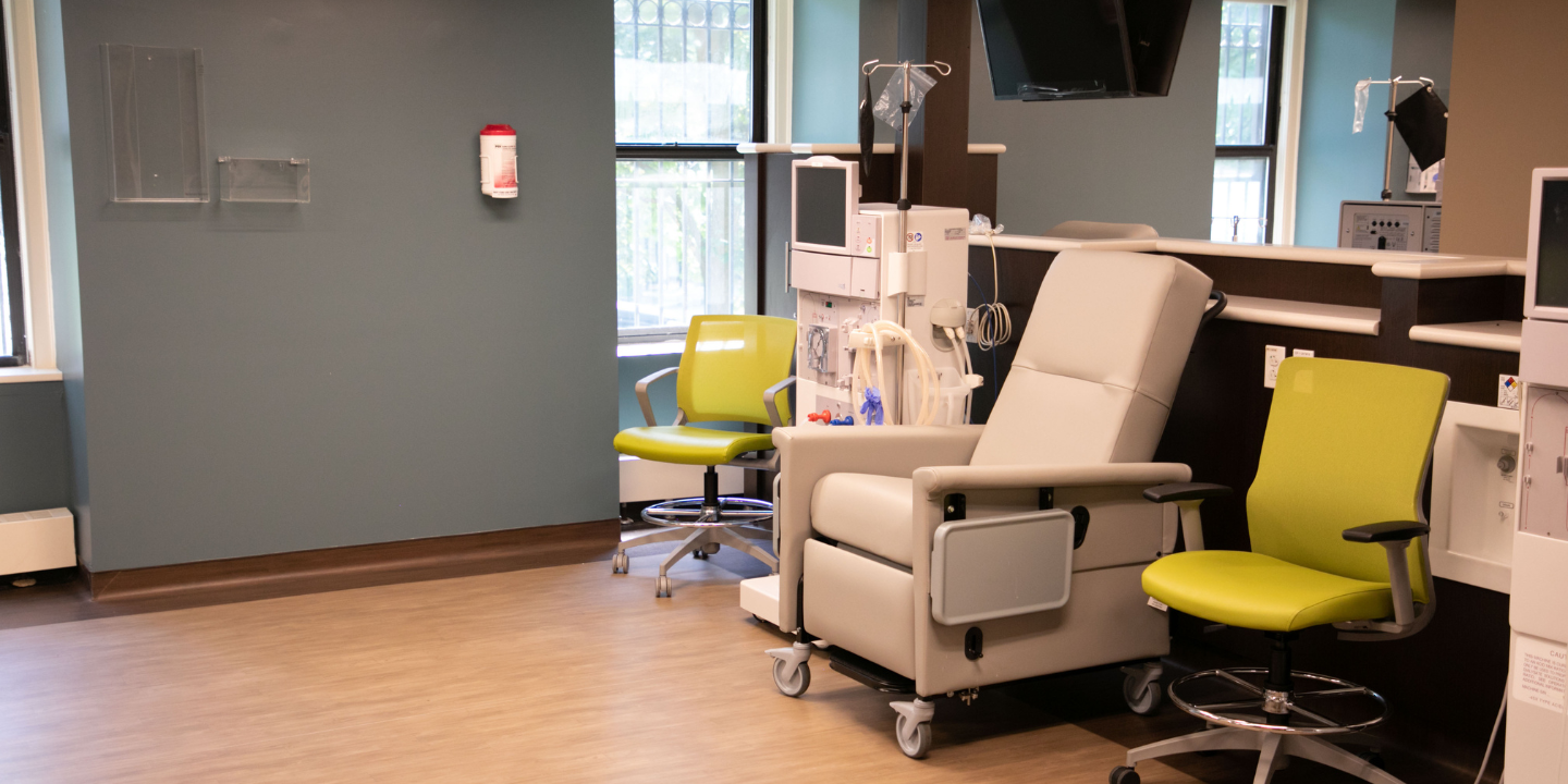 Photo of a hemodialysis chair in a clean and modern room with a TV and other comforts
