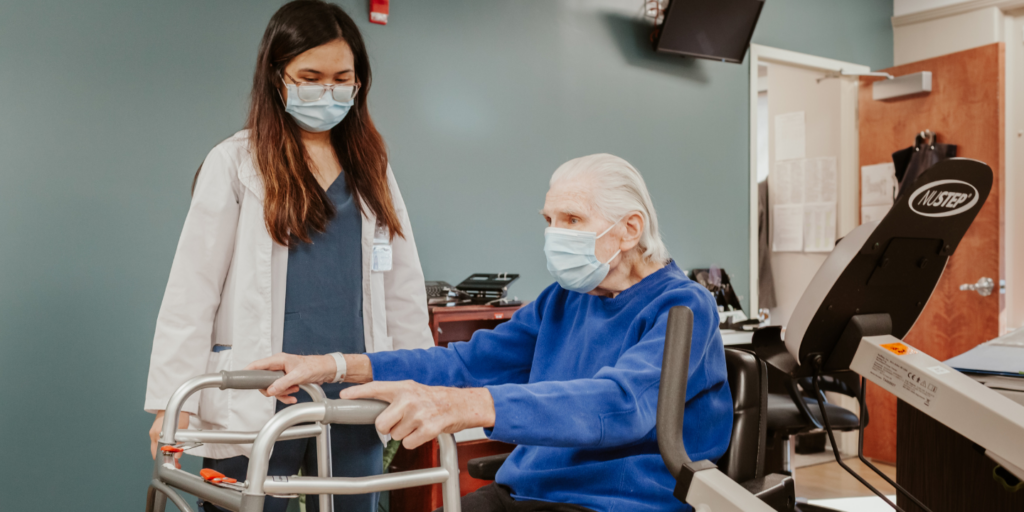 Physical therapist with stroke rehabilitation patient during a therapy session